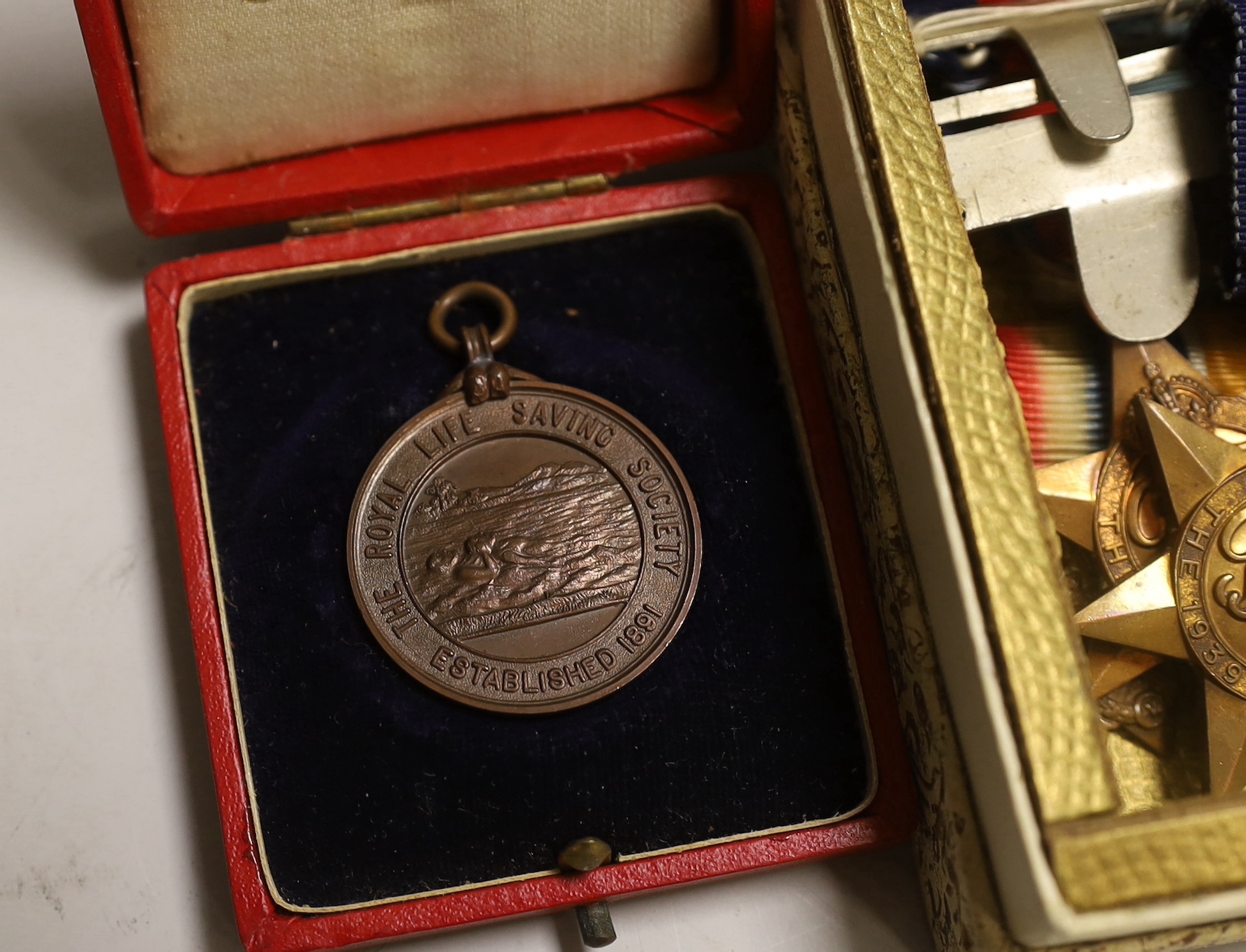 Three WWII medal groups and a German medal etc.